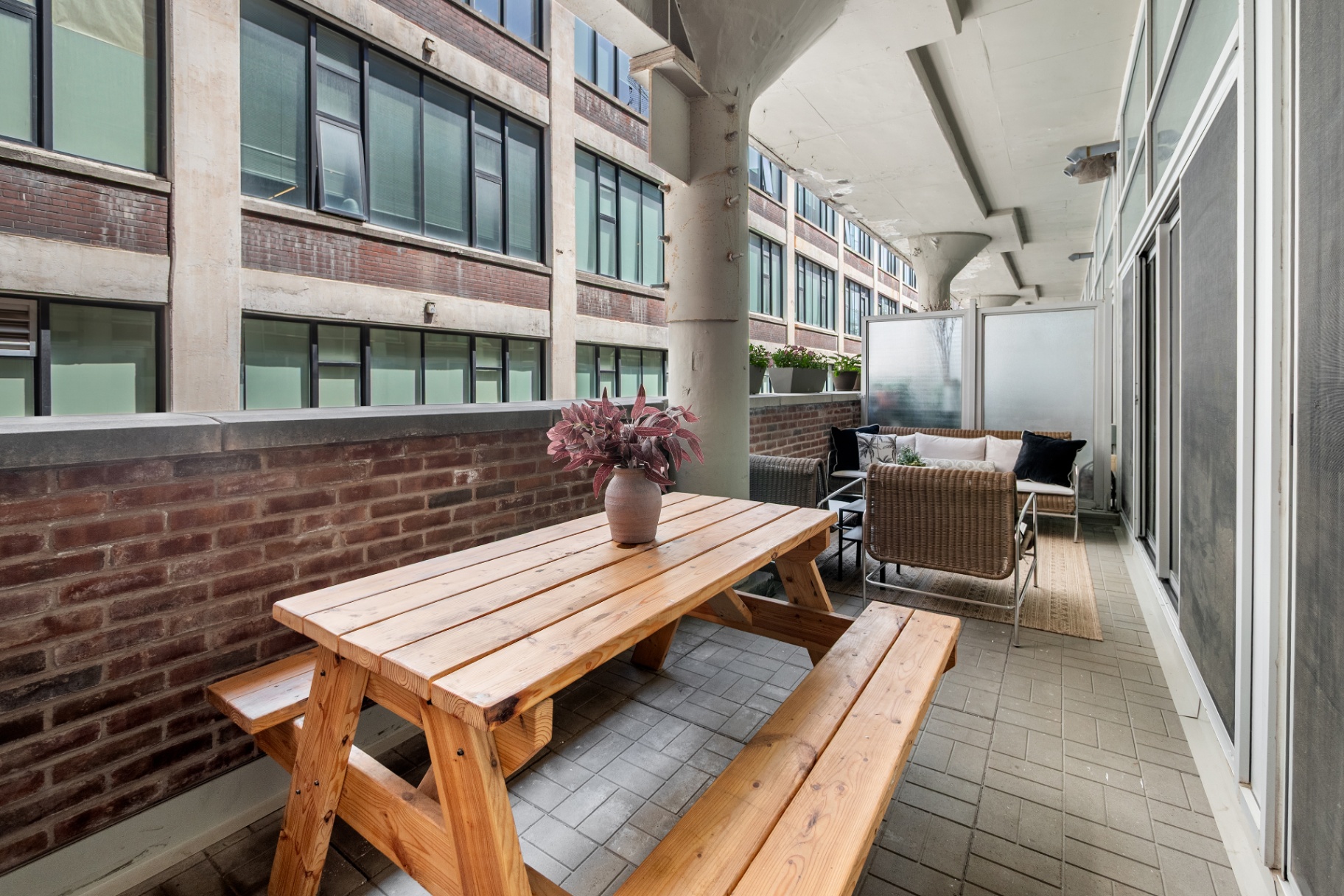 Wide terrace view with picnic table and seating