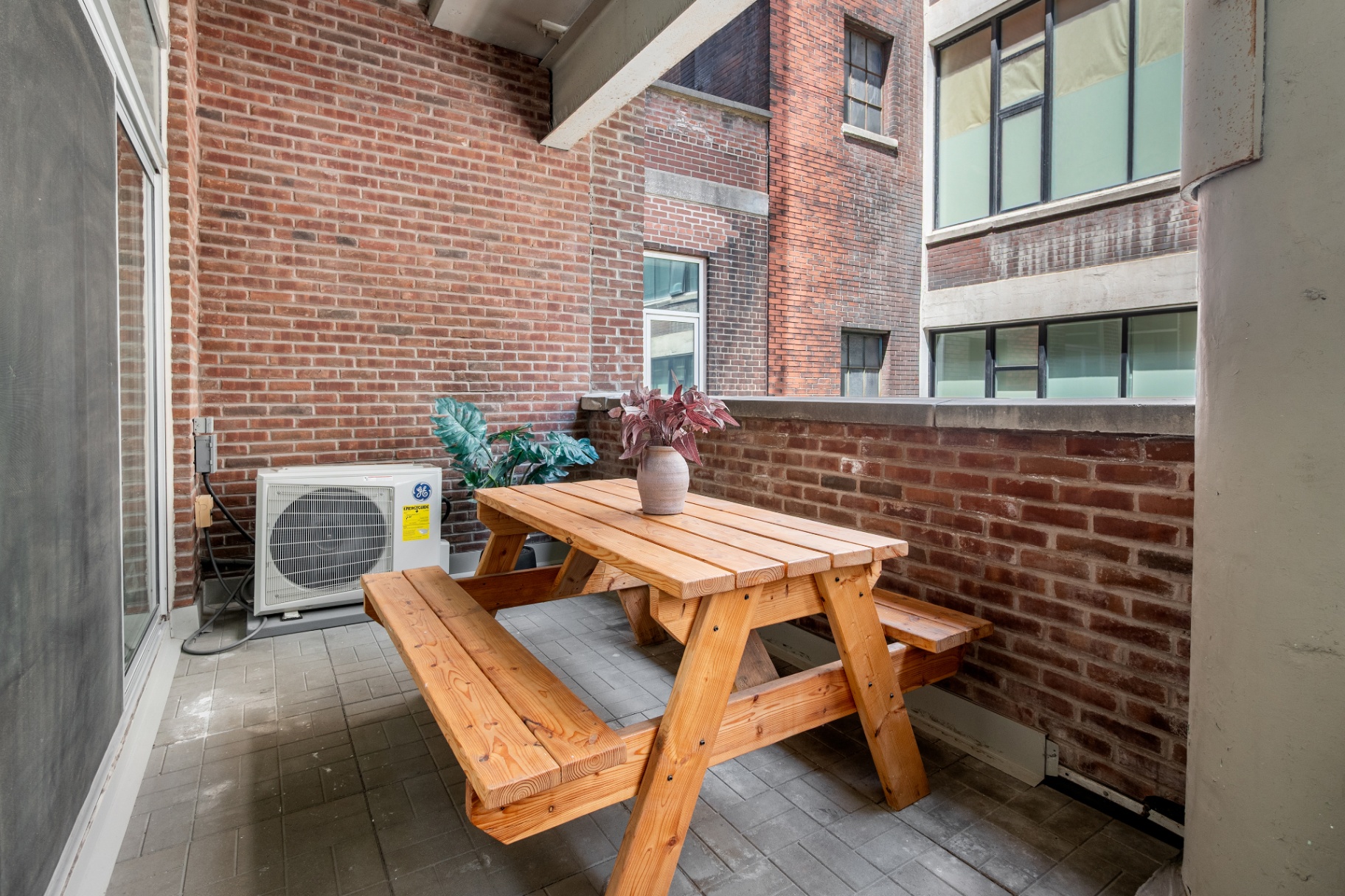 Outdoor terrace dining area with picnic table