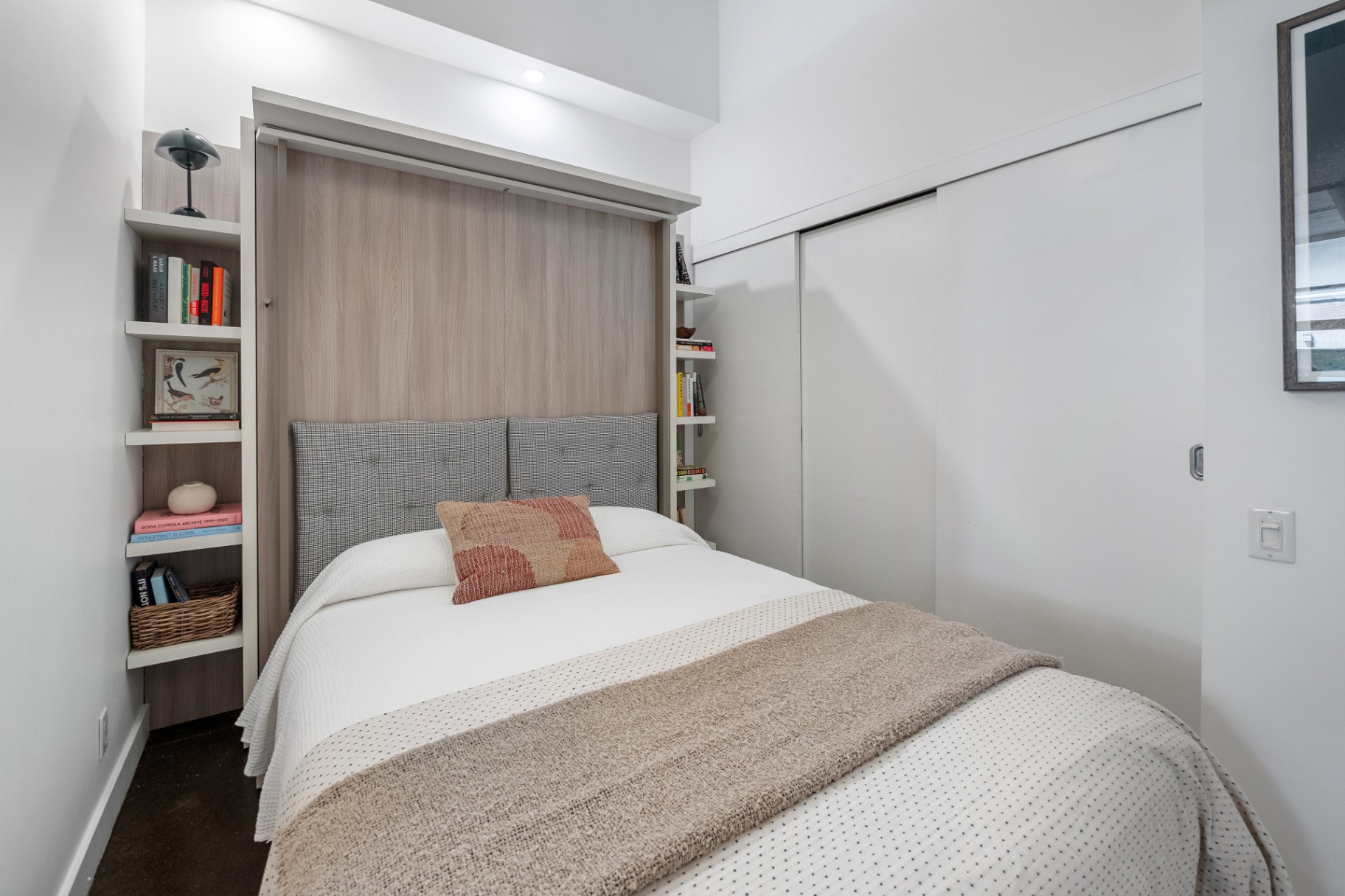 Den with murphy bed and built-in shelving