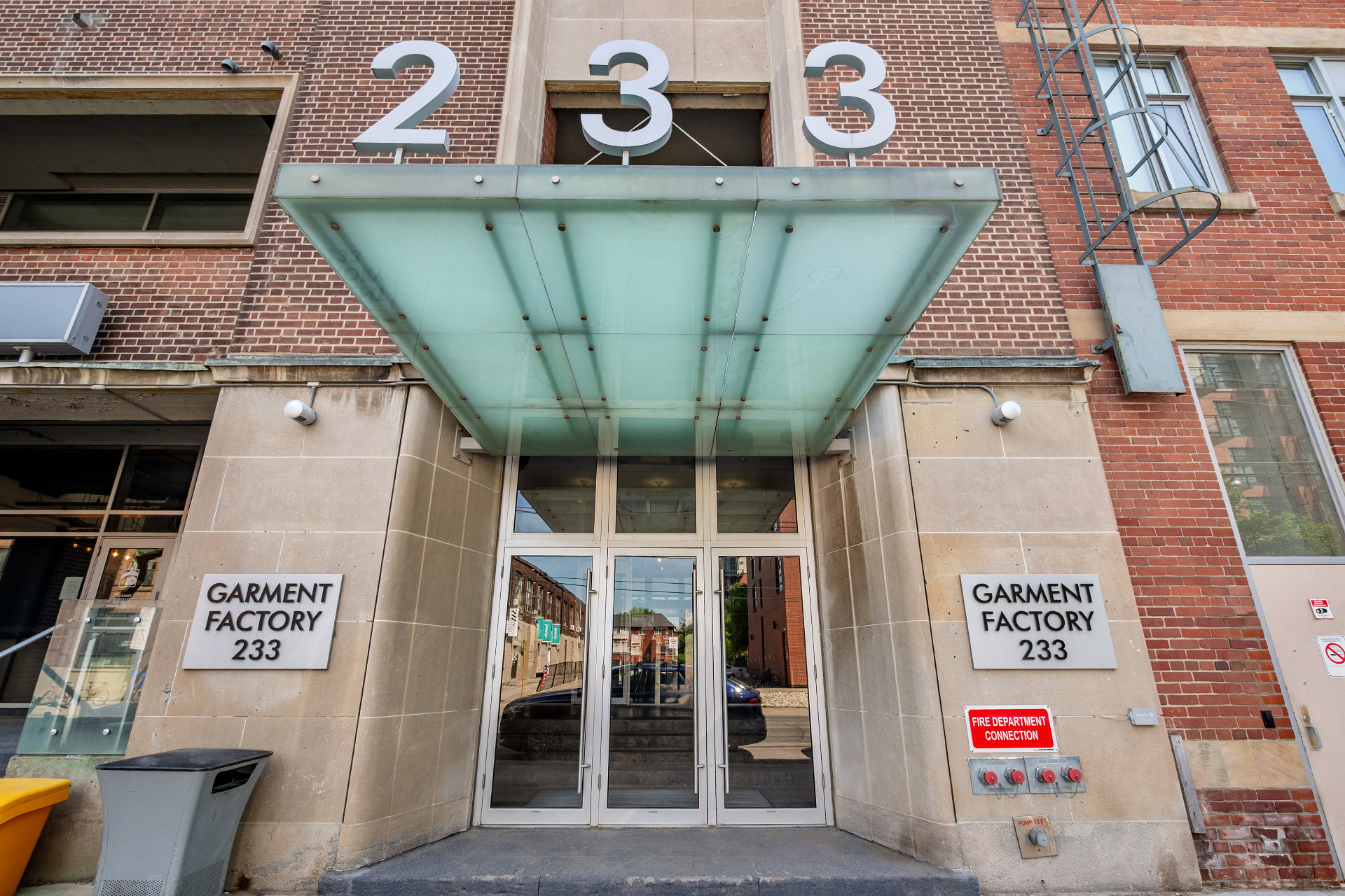 Glass canopy over the 233 building entry doors